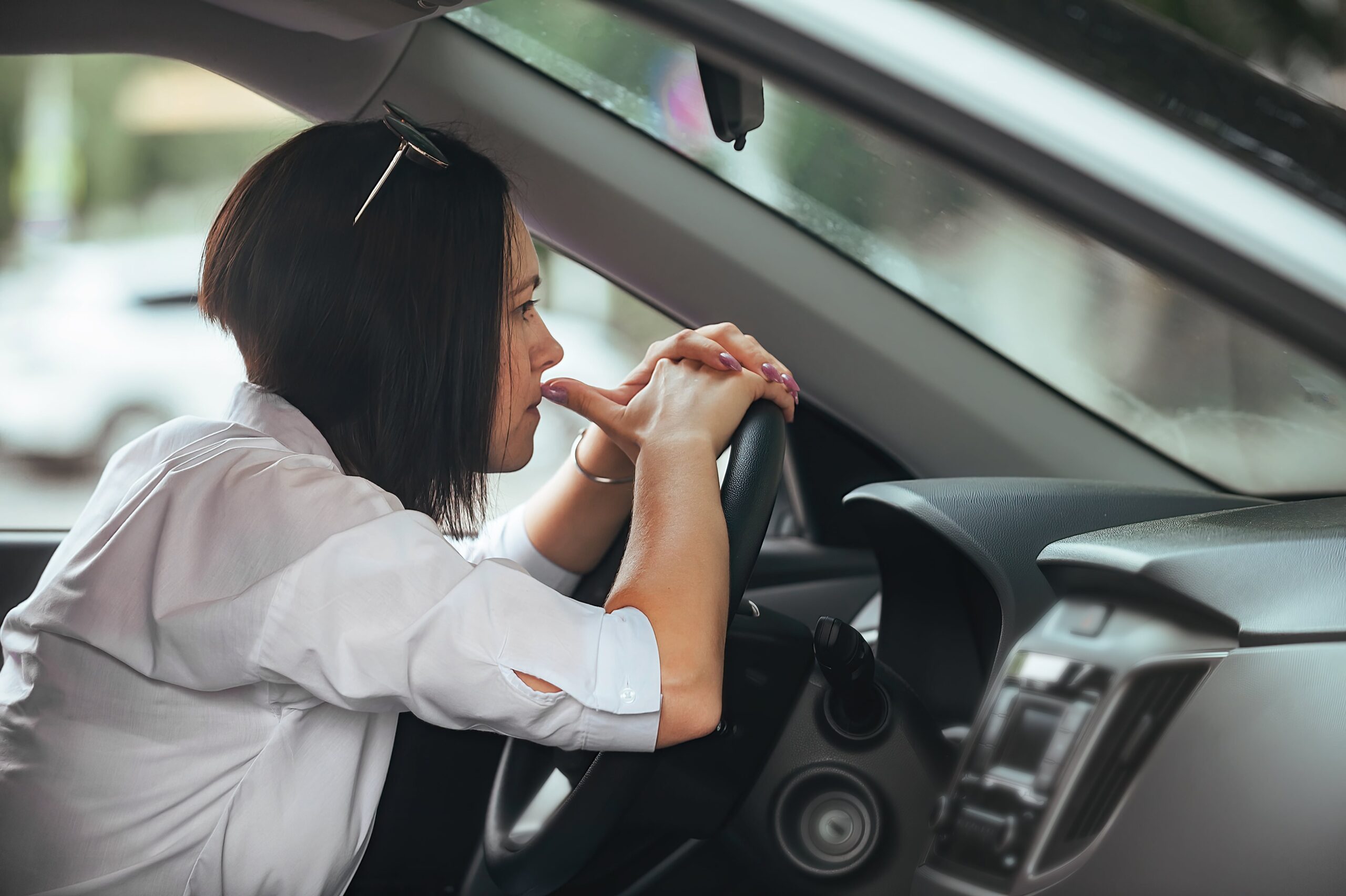 woman with driving phobia sat at wheel of car